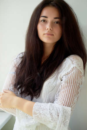 A girl with dark eyebrows , brown eyes and dark hair. Natural beauty. Thick wide eyebrows.
