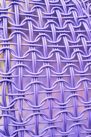 The texture of a wicker chair made of plastic. Processing.Purpleの写真素材