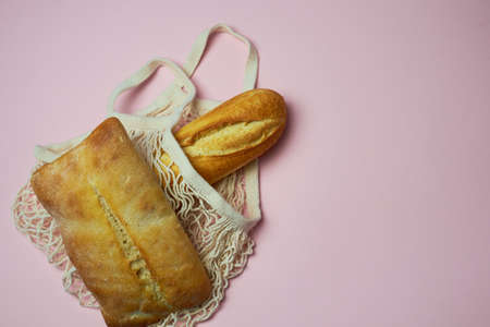 Replacing plastic bags. Taking care of the environment. Simple and delicious country bread. Simple meal. Simple country bread.の写真素材