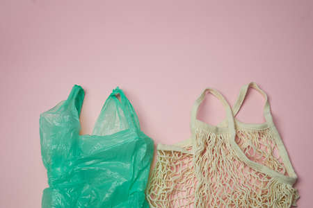 Replacing plastic bags. Taking care of the environment. Replacing plastic bags with eco-friendly reusable bags.の写真素材