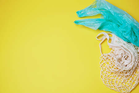 Replacing plastic bags. Taking care of the environment. Replacing plastic bags with eco-friendly reusable bags.の写真素材