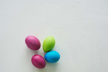 Painted multicolored eggs against a light background. Diet, protein, protein. Preparing for Easter.