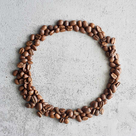 A circle of coffee beans. A place for text. Caffeine addiction.