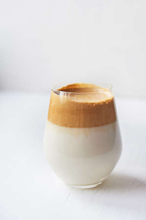 Cold coffee cream with cold Dalgon milk. Trend. In a transparent glass on a white background.の写真素材