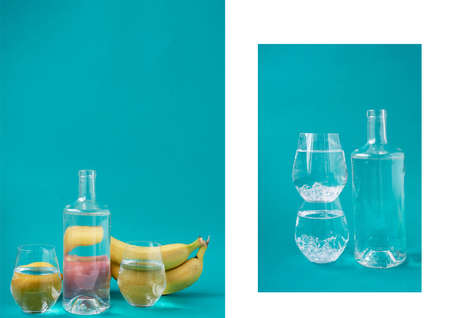 A bottle of water and glasses of ice on a blue background. Thirst quenching. A place for text.の写真素材