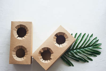 Disposable cardboard coasters. Fastwood, takeaway food. A drink stand.