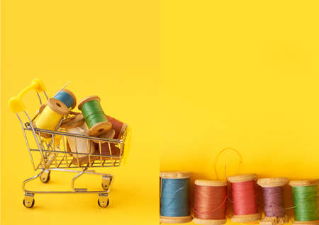 Colored coils with threads on a yellow background.Handicrafts and sewing.の写真素材