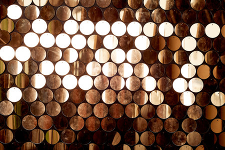 Texture, wall with round gold sequins. The atmosphere of glamourの写真素材