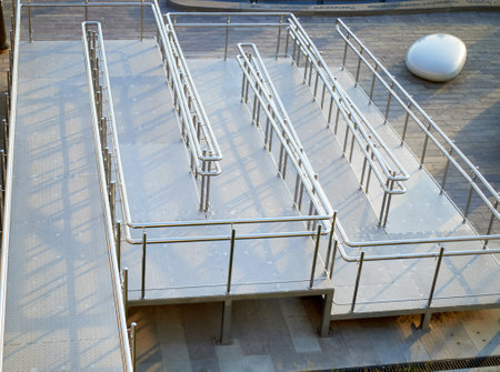 A long zigzag ramp for strollers and wheelchairs. Amenities for people with disabilities.の写真素材