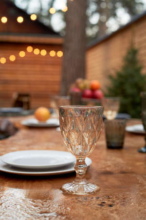 Covered table on the terrace. A table wet from the rain. The atmosphere in the restaurant.