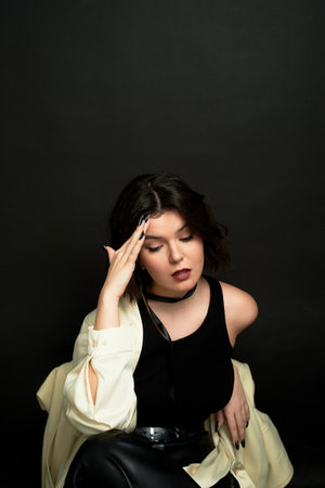 Brunette of European appearance. Reflections, a difficult life situation. Choice.の写真素材