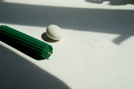 Green money candle made of honeycomb. Natural wax. Magic, mysticism and esotericism.の写真素材