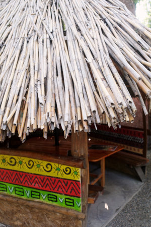 A hut with a thatched roof in an African village. Ethnic.の写真素材