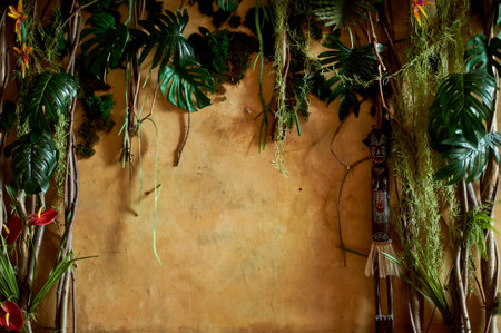 The wall is in African style. Color: sand, green vines and African figurine.の写真素材