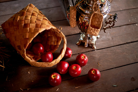Wedding decoration in the Slavic style. Birch bark box with scattered apples.の写真素材