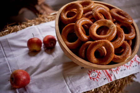 Wedding decoration in the Slavic style. Large sushki and bagels in a large wooden dish. Russian styleの写真素材