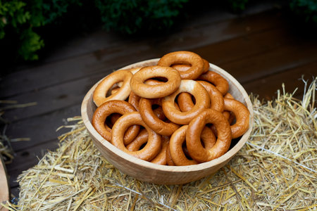 Wedding decoration in the Slavic style. Large sushki and bagels in a large wooden dish. Russian...