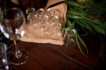 Wedding decoration in the Slavic style. Glasses for alcoholic beverages on a cotton napkinの写真素材