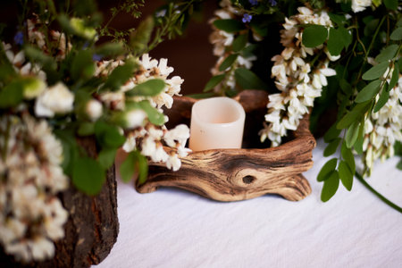 Wedding decoration in the Slavic style. Flower arrangements in stumps and snagsの写真素材