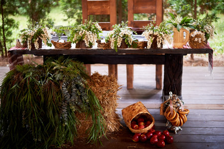 Wedding decoration in the Slavic style. Flower arrangements in stumps and snagsの写真素材