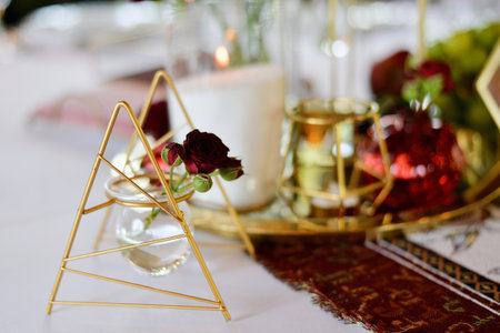 Red decorative vase in the shape of a pomegranate. Wedding table d cor.の写真素材