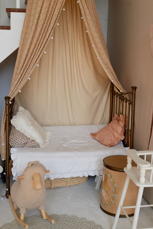 The bed is in a beige natural style with cotton pillows and a canopy. Comfort and tranquility at...