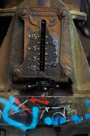 Paint on rusty metal. Rough style, background image. Railway, graffiti.