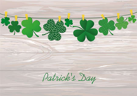 Petals of decorative clover four-leaf hanging on a rope with clothespins. St.Patrick 's Day. Vector illustration. Greeting card with empty space for text or advertising. On a wooden background.のイラスト素材