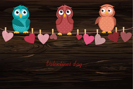 A red heart with a picture hanging on a rope. Cute owl sitting. Valentine's Day. Vector illustration. Greeting card with empty space for the label or advertising. On a wooden background.のイラスト素材