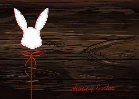 Paper easter bunny. Head of a rabbit on a stick with a bow and ribbon. Vector on wooden background.のイラスト素材