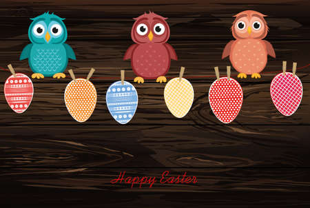 Multicolored Easter eggs made of paper hanging on a rope. Cute owls sitting. Vector on wooden back. Greeting card or invitation for a holiday with a blank space for a label or advertisement.のイラスト素材