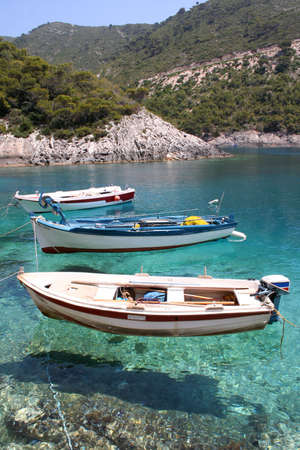 small fishing boats anchored at Porto Vromi, Zante (Zakynthos)の写真素材