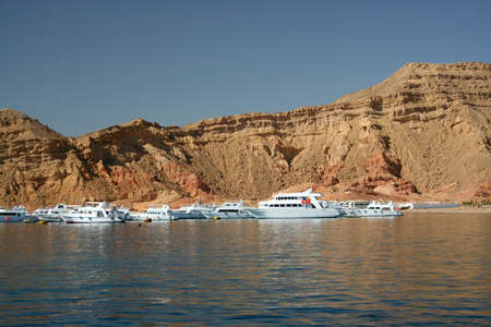 dive boats moored at a dive site in the Red Sea, Egyptの写真素材