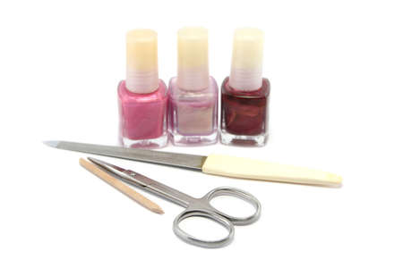 choice of pretty pinks and purple nail colours and a manicure set. Focus is on the scissorsの写真素材