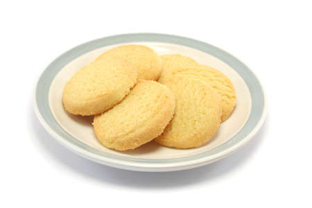six shortbread biscuits/cookies on a plateの写真素材