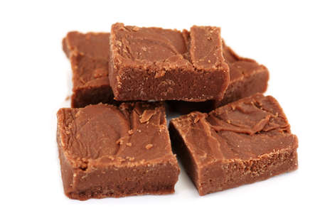 Small pile of homemade chocolate fudge pieces on a white backgroundの写真素材