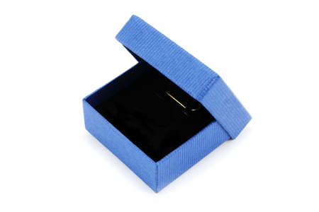 Small blue gift box for presenting jewellery items such as earrings or pendantsの写真素材