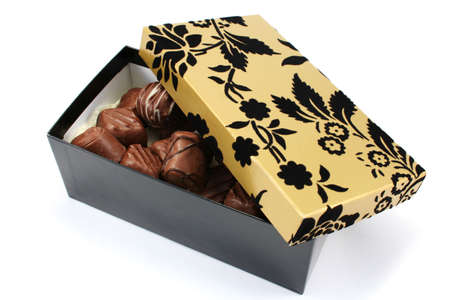 Fancy black and gold gift box with handmade chocolatesの写真素材