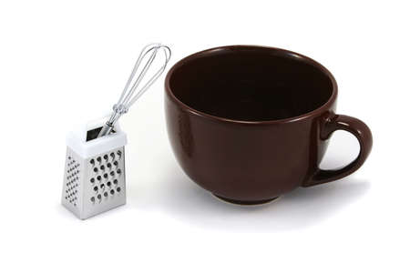 large brown cappuchino coffee mug with chocolate grater and mini whiskの写真素材