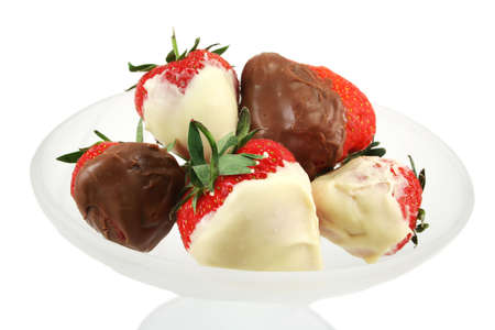 Milk and white chocolate dipped fresh strawberries in a frosted glass dishの写真素材