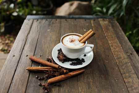 Composition with white cup of coffeeの写真素材