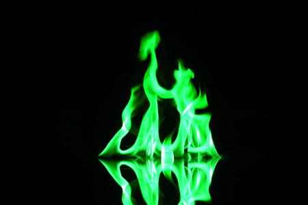 green flame fire on black backgroundの写真素材