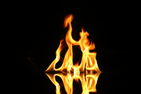Flame of fire in a night-timeの写真素材