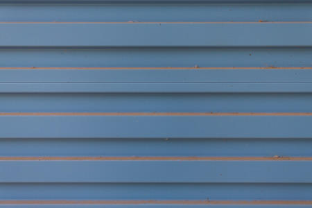 rusty blue corrugated metal wall