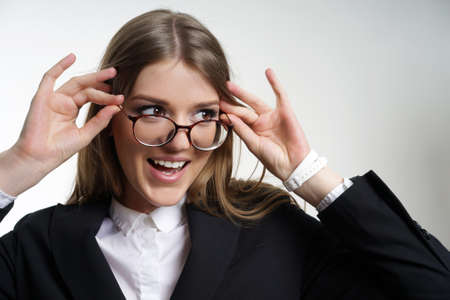 Portrait of a girl in glasses with a big smile teeth. ? Oncept of healthy vision.の写真素材