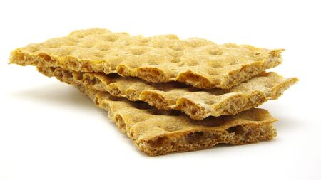 Three crispbread of Rye flour. Inaccurate stack. Isolated on white background.の写真素材