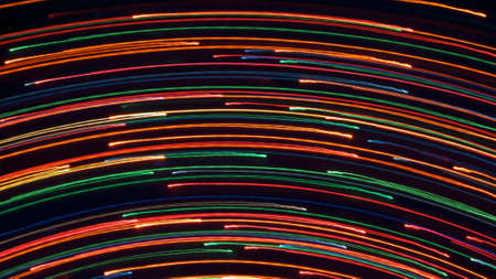 Different lights on a black background. Lifted in motion. A variety of form Fluorescent traces.