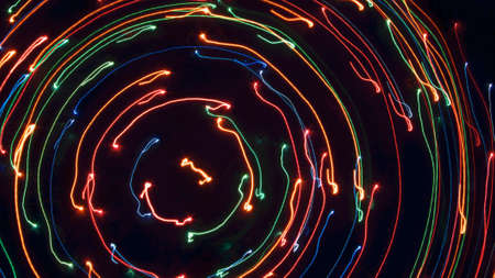 Different lights on a black background. Lifted in motion. A variety of form Fluorescent traces.の写真素材