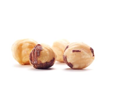 Four salted  nut isolated on a white background. Background blurred.の写真素材