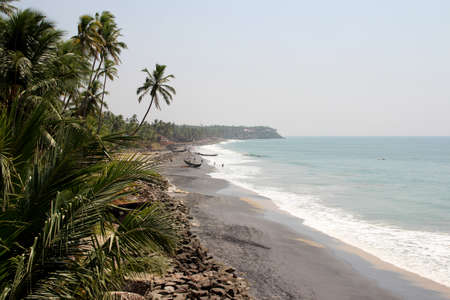 Romantic view of Kerala beach with palms in the foregroundの写真素材